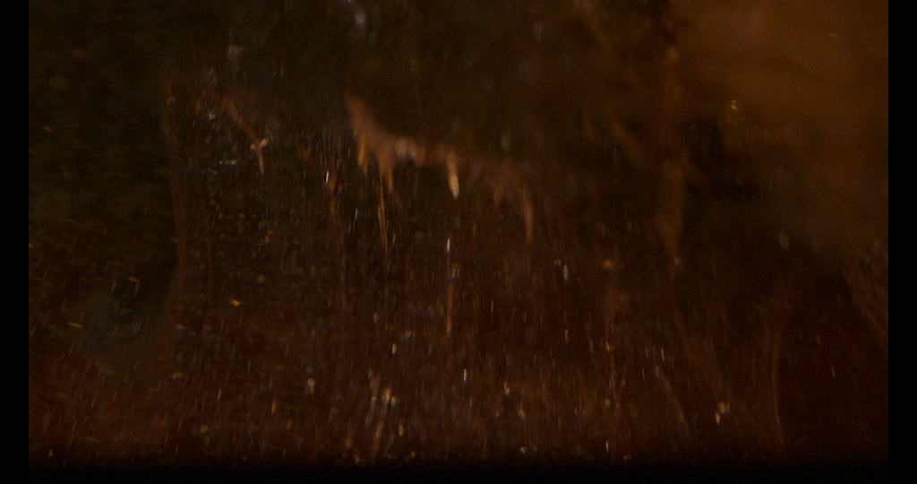 Frame grab coloured viscous fluids mixing.